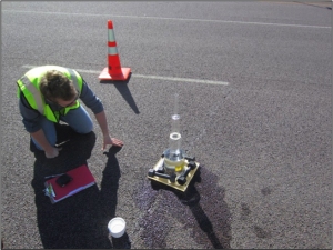 A researcher conducts a test on a pothole