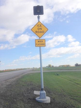 warning sign indicating ice on road when flashing
