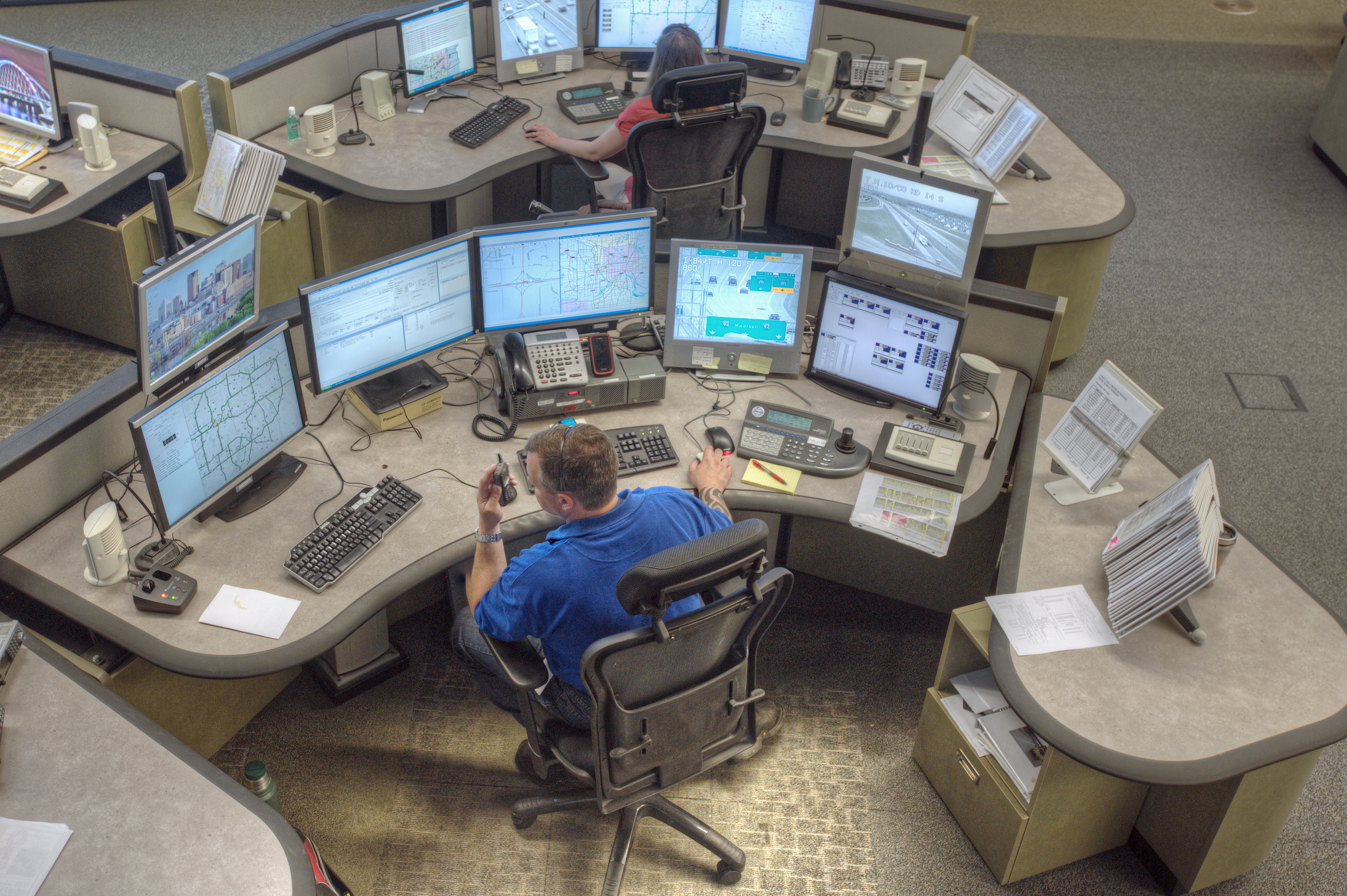 Overhead view of RTMC operator monitoring multiple screens